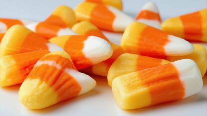 American candy corn lying on a white surface