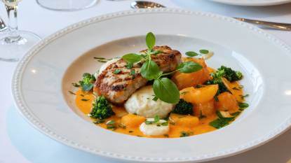 A plate of typical French Cuisine Served on a White Plate