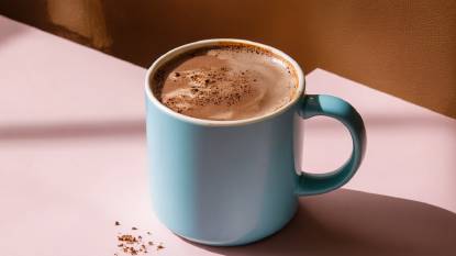 A blue mug containing a high quality Hot Chocolate drink
