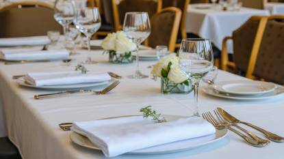 Formal place setting at a table in a high-end restaurant