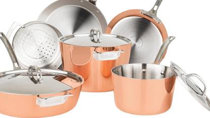 Viking Contemporary 4-Ply 9-Piece Copper Cookware Set on a modern stove with copper pots and pans arranged.
