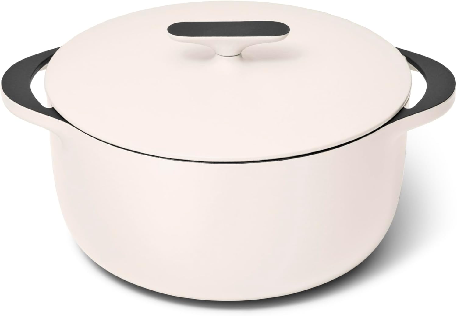Caraway enameled cast iron Dutch oven in a cream color on a modern kitchen stovetop