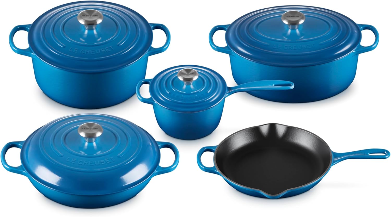 Le Creuset Signature 9-Piece Cookware Set in Marseille blue displayed on a kitchen countertop, showing the full collection of Dutch ovens, braiser, saucepan, and skillet