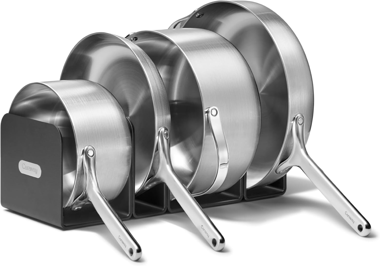 Caraway 5-Ply Stainless Steel Cookware Set arranged on a modern kitchen counter with the magnetic storage rack.