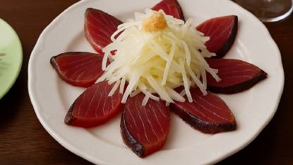 Slices of Bonito arranged on a plate