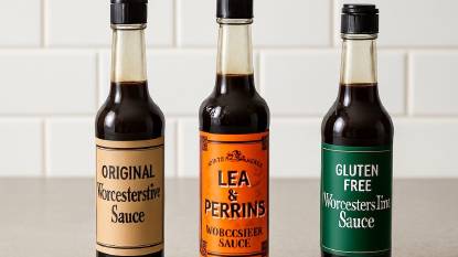 3 types of Worcestershire Sauce bottles in a row on a white kitchen counter